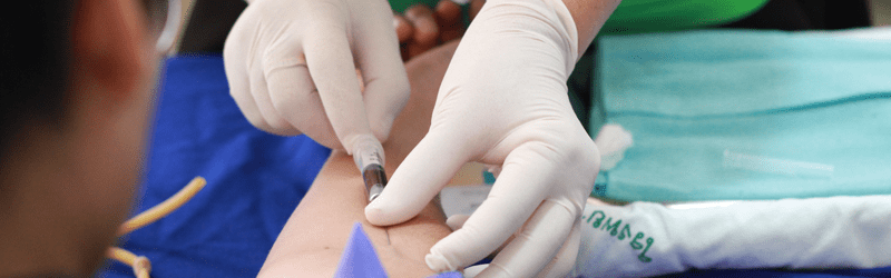Phlebotomist drawing blood