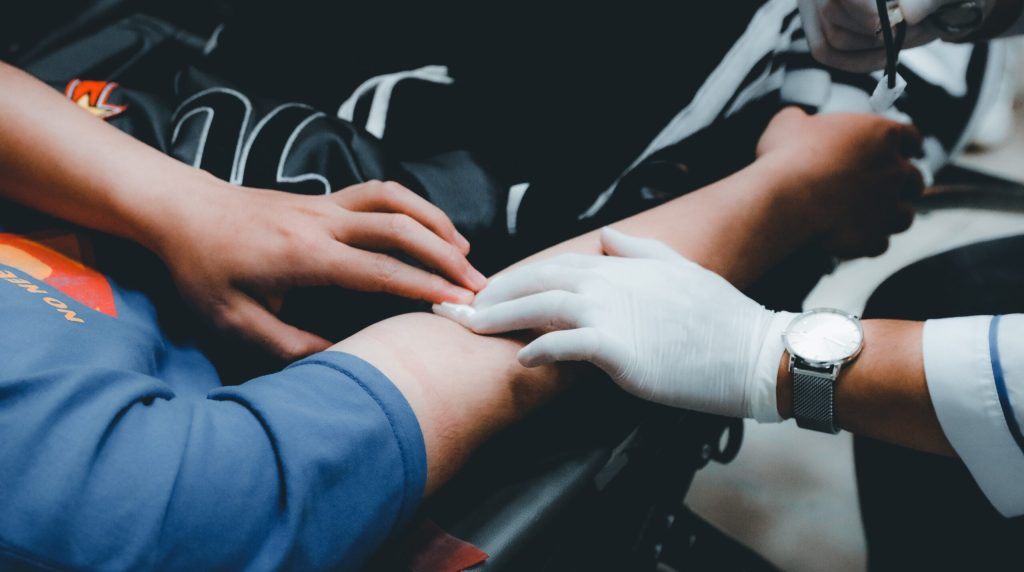 Phlebotomist drawing blood